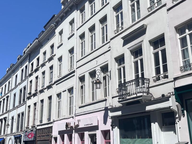 White facade of the 1860 townhouse on Rue Saint-Jean in central Brussels, 200 metres from the Grand-Place