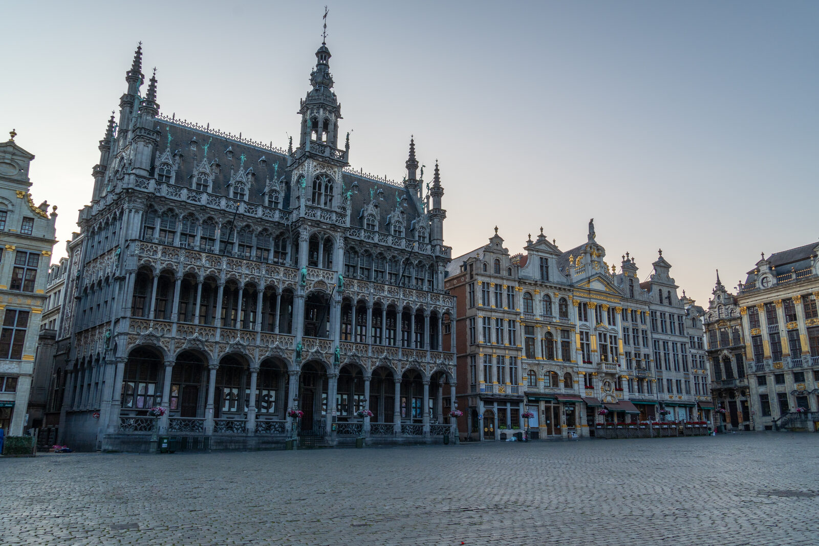 The Maison du Roi and the guildhouses of the Grand-Place in Brussels at first light, the square empty